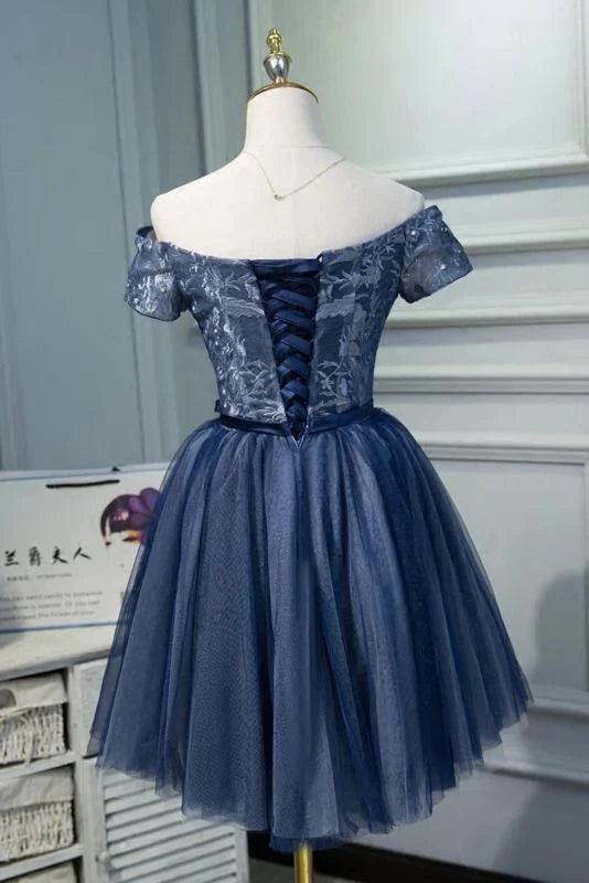 Elegant off-shoulder graduation gown featuring a belt and floral appliques.