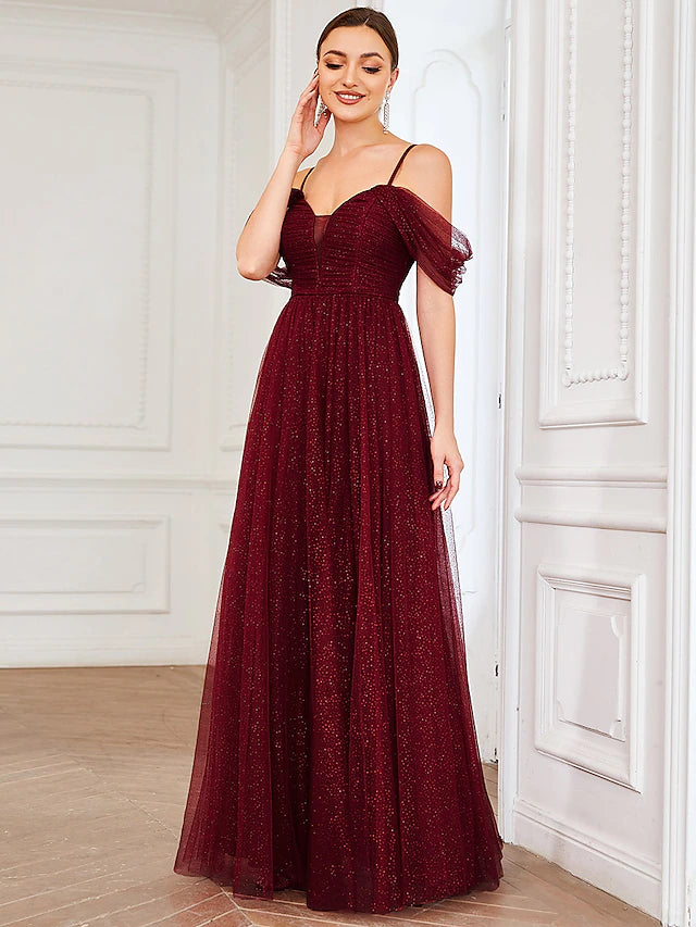Close-up of draped and ruched tulle fabric on dress.