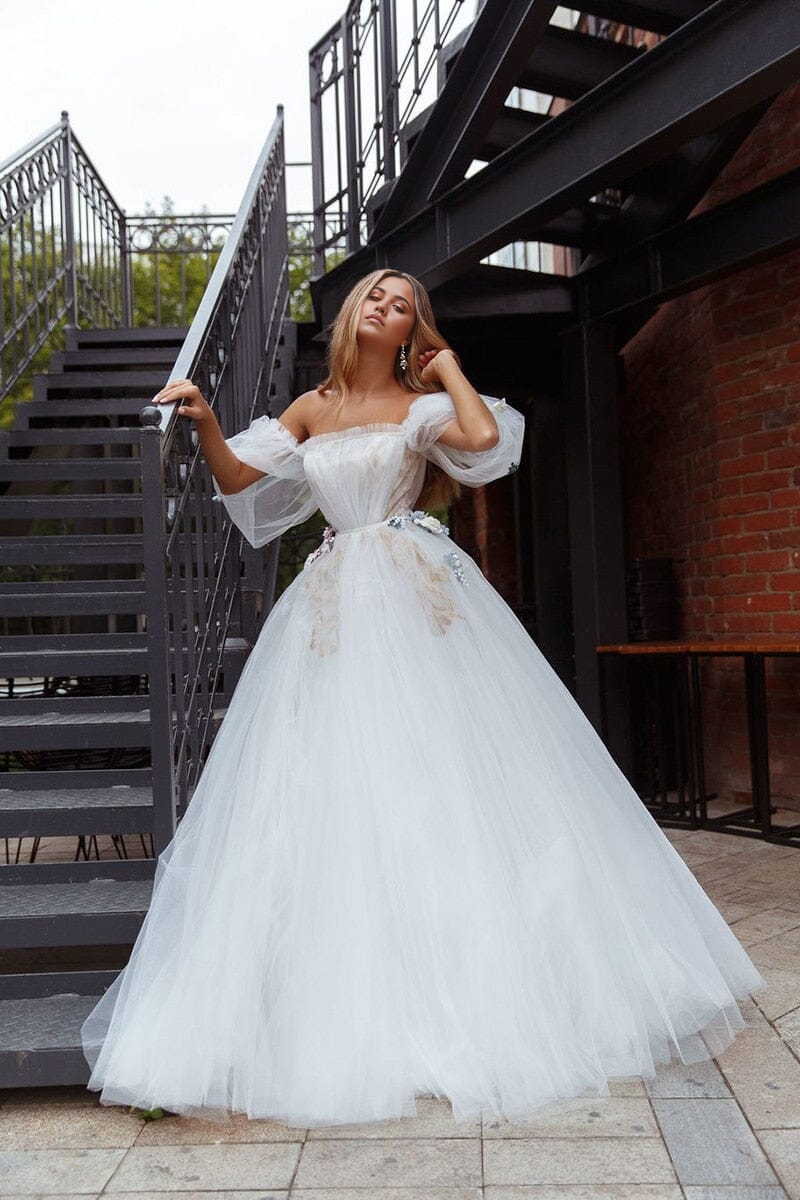 A-Line off-shoulder tulle princess wedding dress, front view.