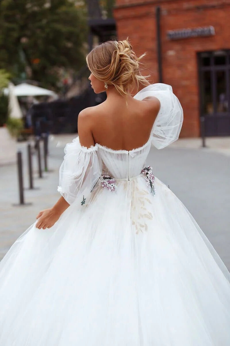 Back view of the A-Line off-shoulder tulle wedding dress.