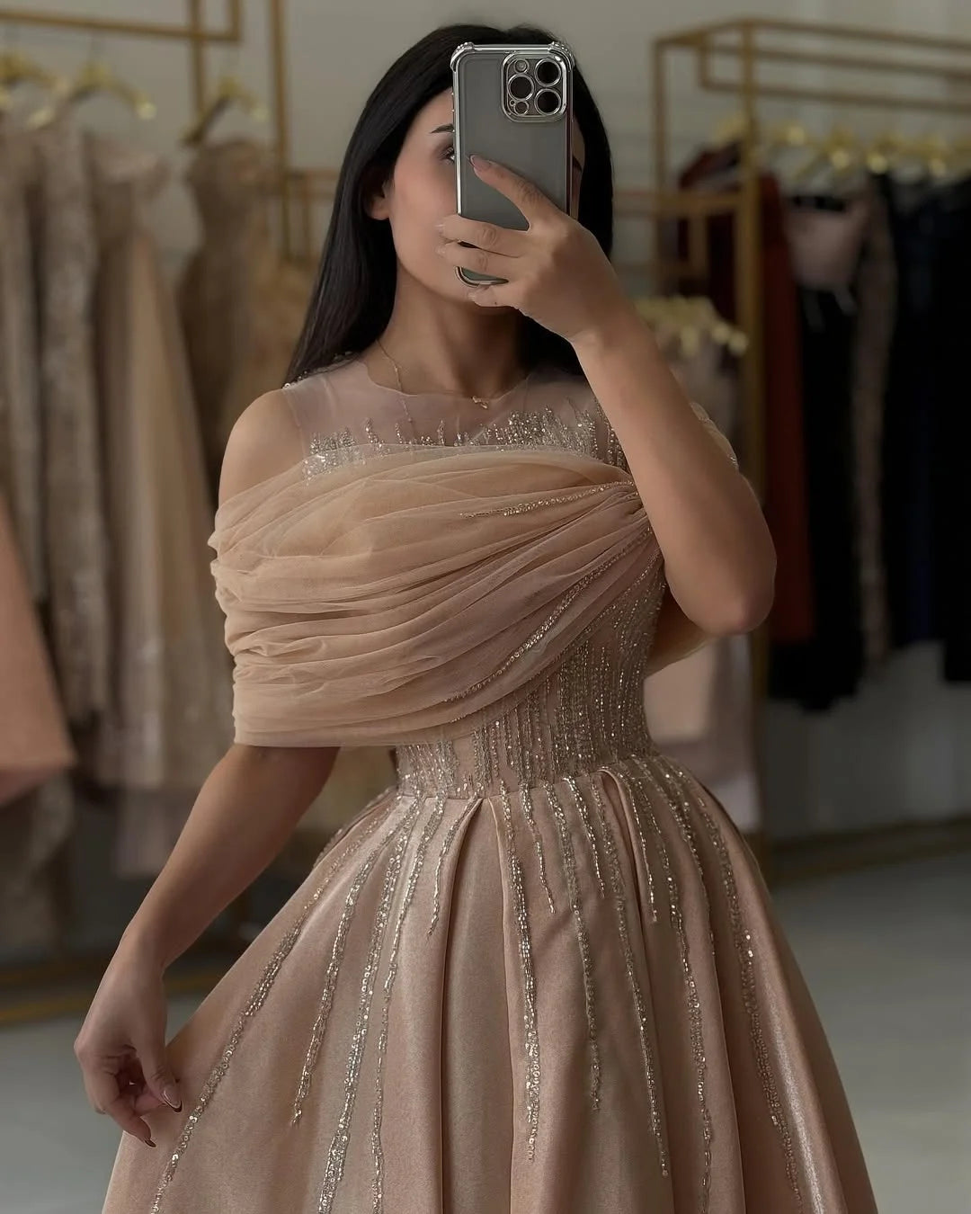 Side view of A-line off-shoulder V-neck prom dress with bead details.