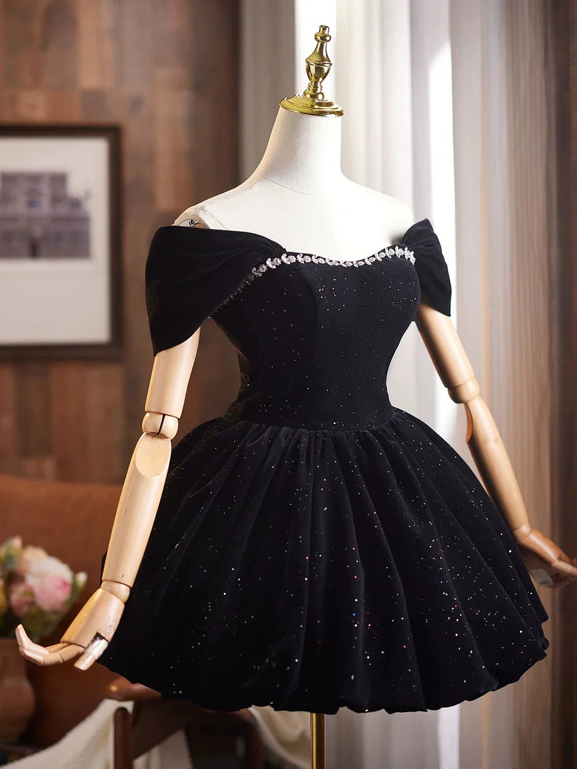 Side profile of glittered black velvet A-line dress.