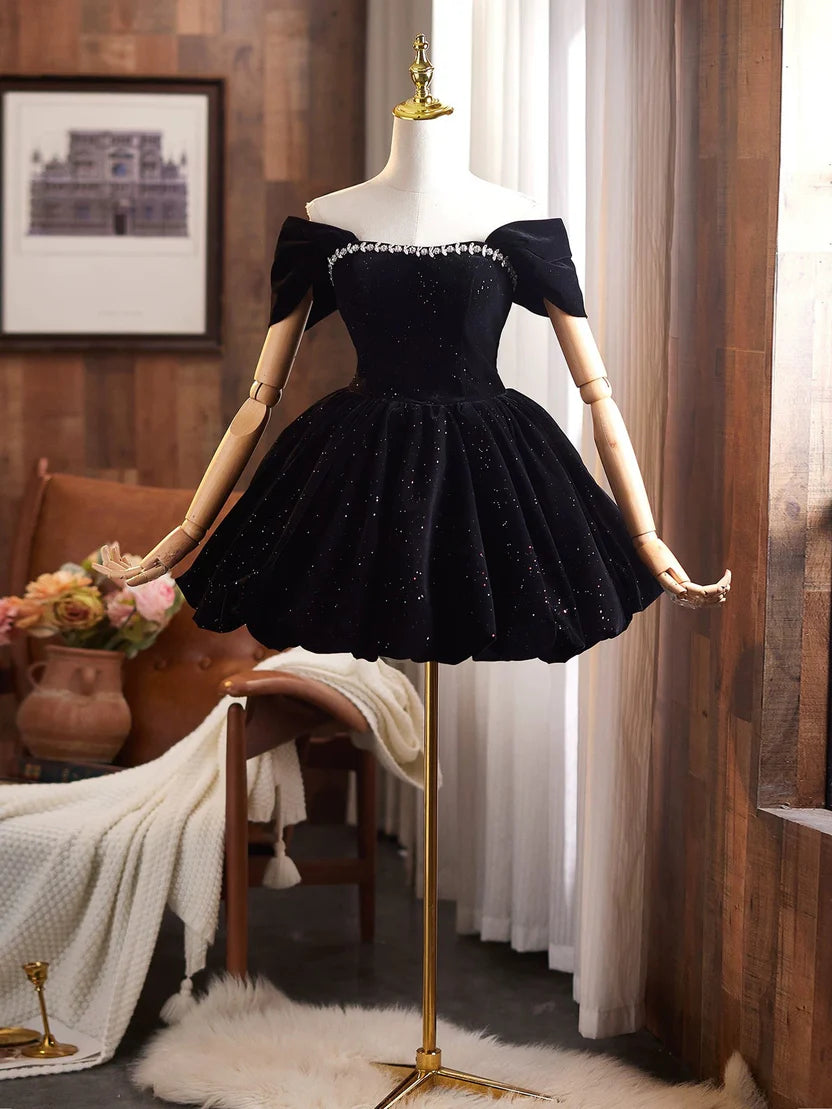 Close-up of the glittered velvet fabric on the black homecoming dress.