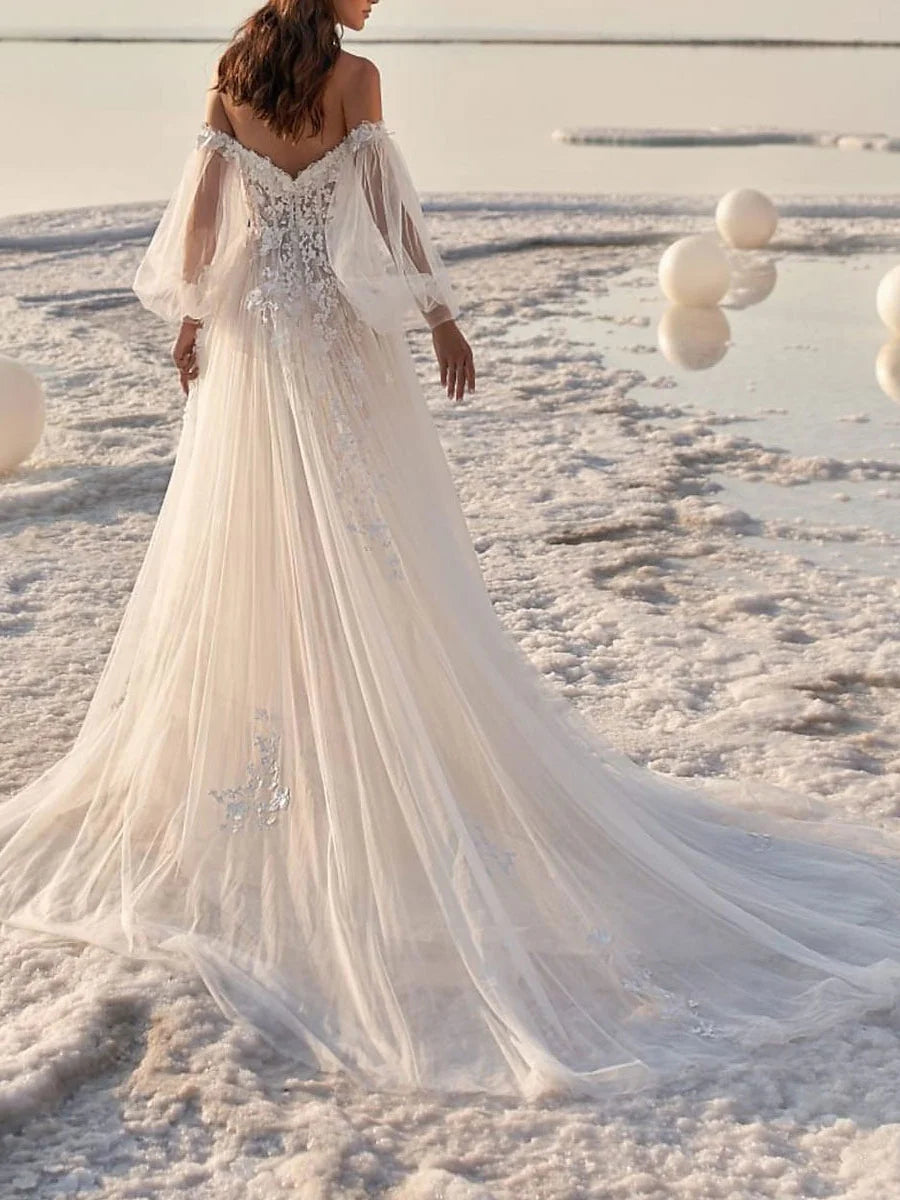 Side view of an A-line off-shoulder wedding dress, showcasing the flowing skirt and court train.