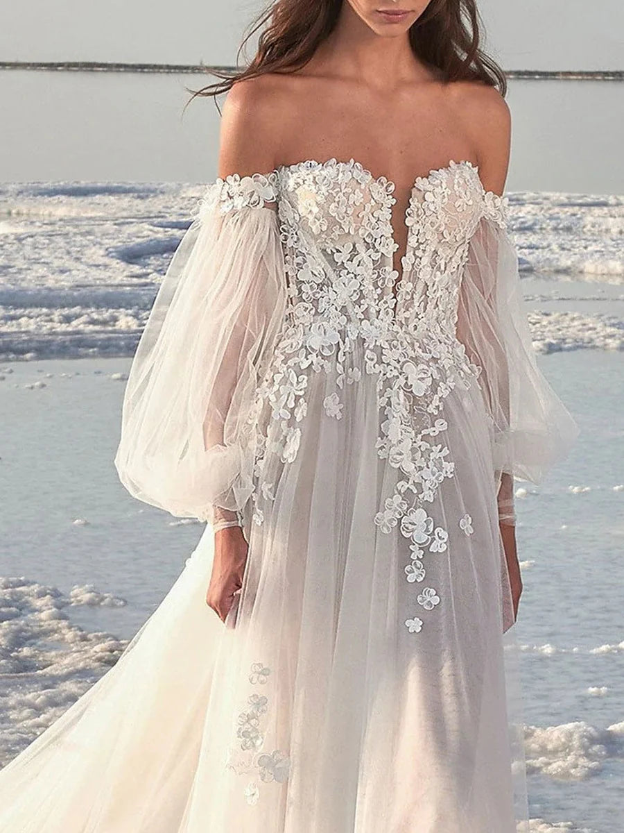 Back view of an A-line off-shoulder wedding dress, highlighting the delicate court train.