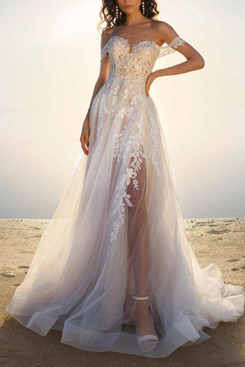 A-line off-shoulder wedding dress with lace appliques, front view.