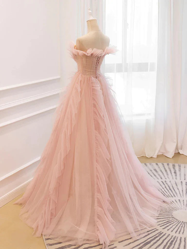 Back view of a flowing A-line off-the-shoulder tulle long prom dress.