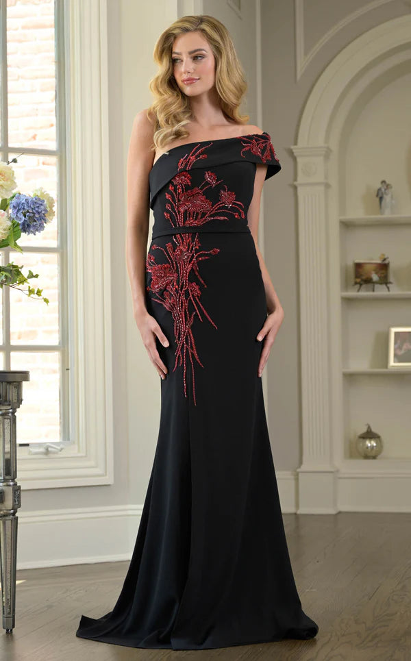Close-up of the beaded detail on the bodice of the one-shoulder dress.