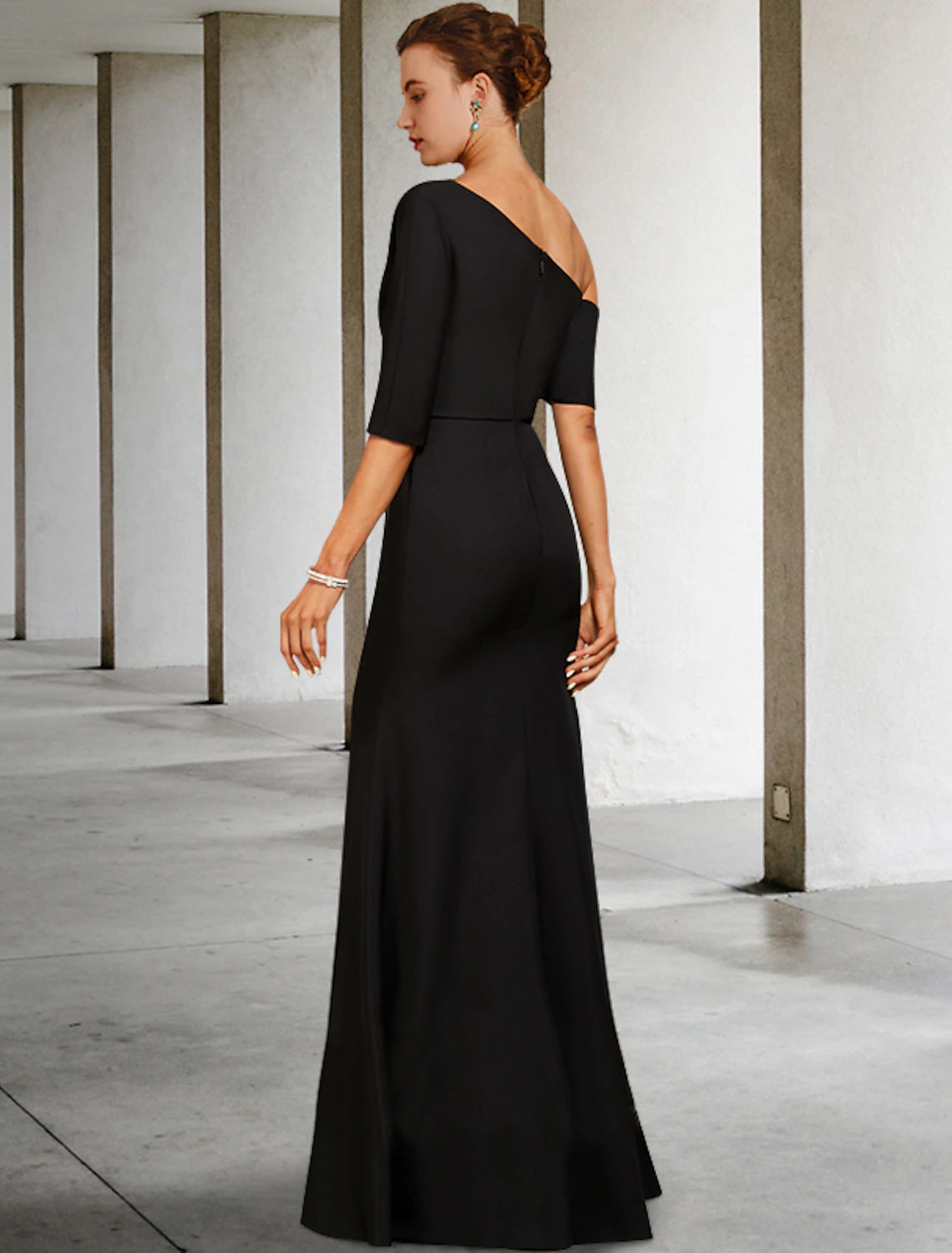Side view of the A-line one-shoulder charmeuse dress with ruffles.