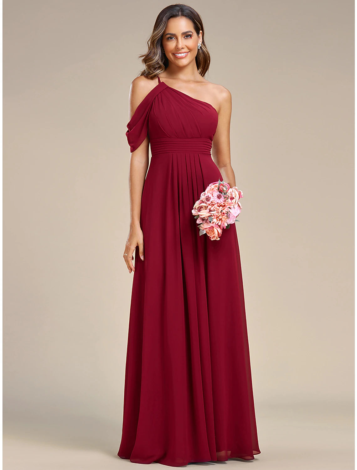 Close-up of the ruched slit and flowing chiffon fabric of the elegant one-shoulder dress.