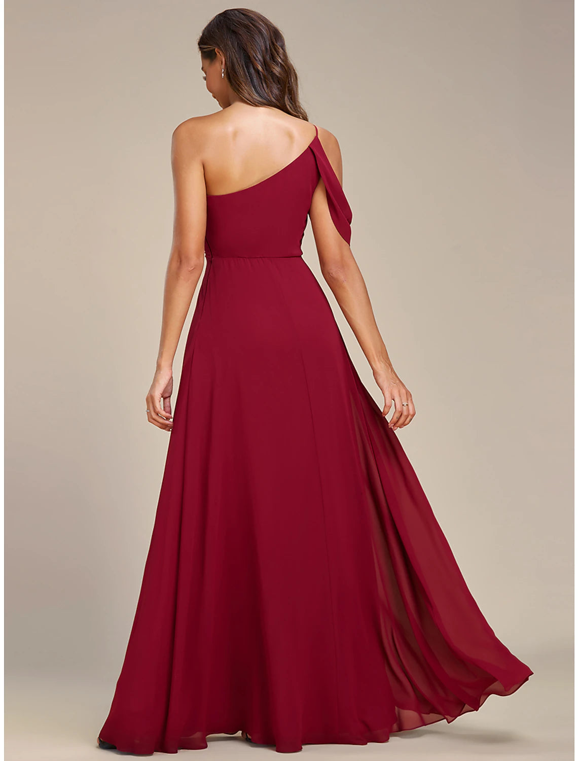 Model in a dynamic pose, highlighting the movement and floor-length design of the A-line dress.