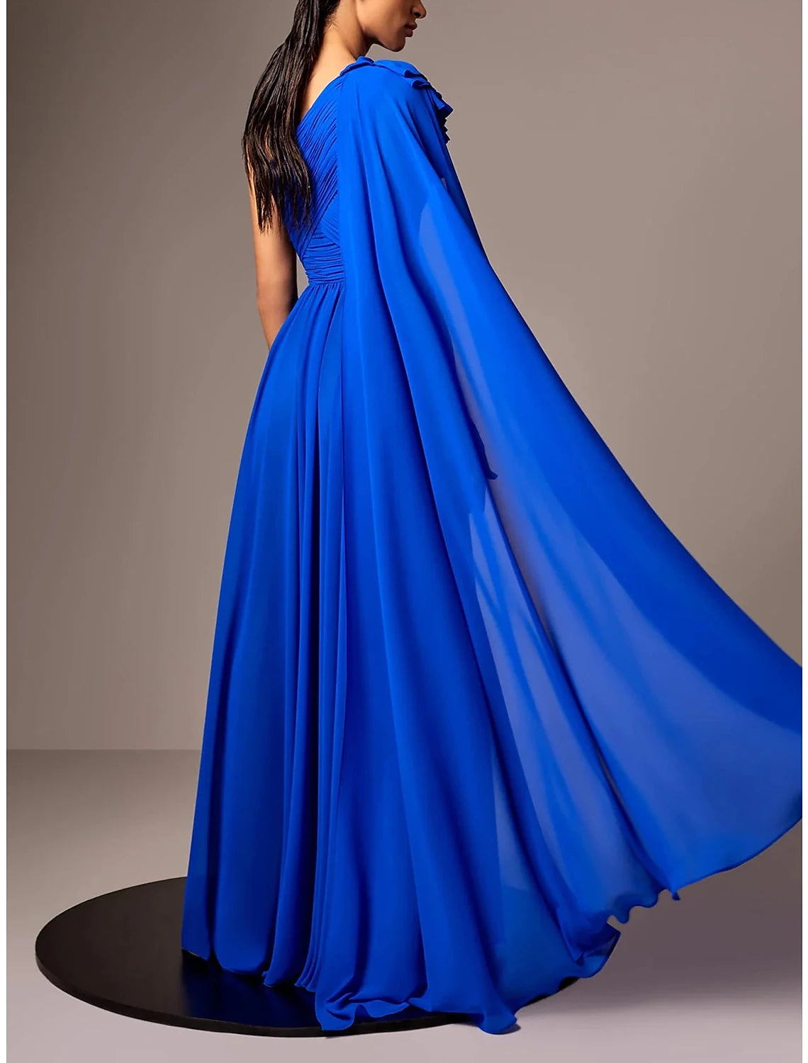 Back view of the A-Line one-shoulder chiffon gown, showcasing the flowing floor-length skirt.