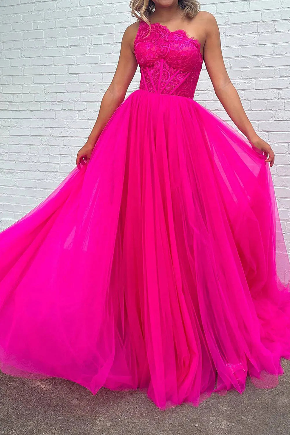 Close-up of the corset detail and high front split on the prom dress.
