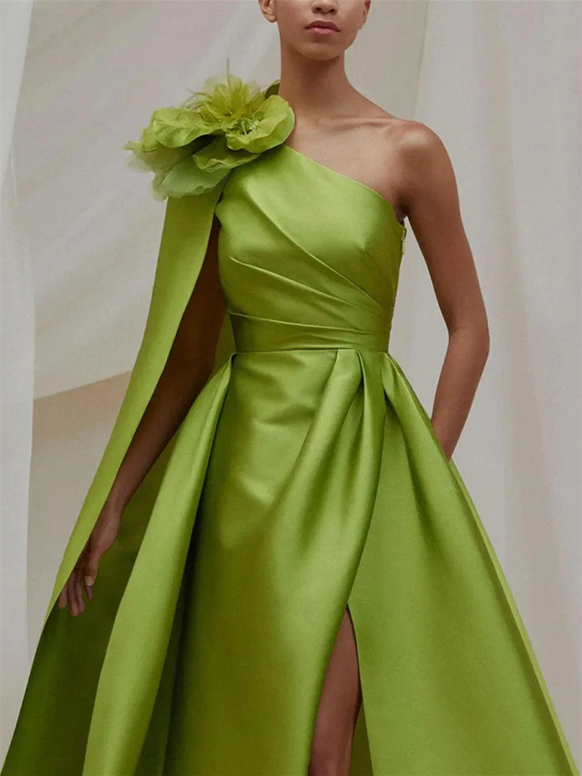 Back view of A-Line one shoulder formal dress showing sweep train.