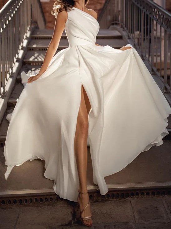 Model wearing an elegant A-Line one-shoulder floor-length wedding dress.