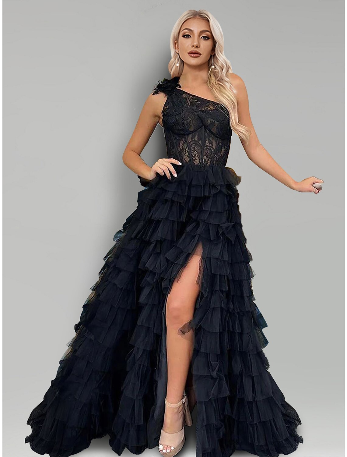 Elegant A-line one-shoulder gown with lace appliques and a high slit.