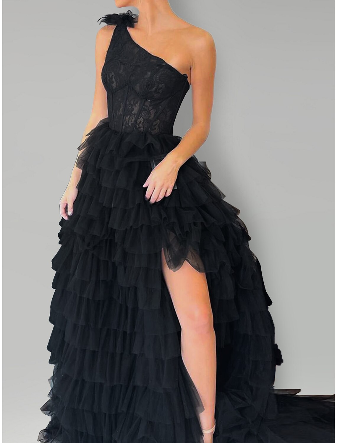 Back view of the formal one-shoulder lace dress with sweep train.