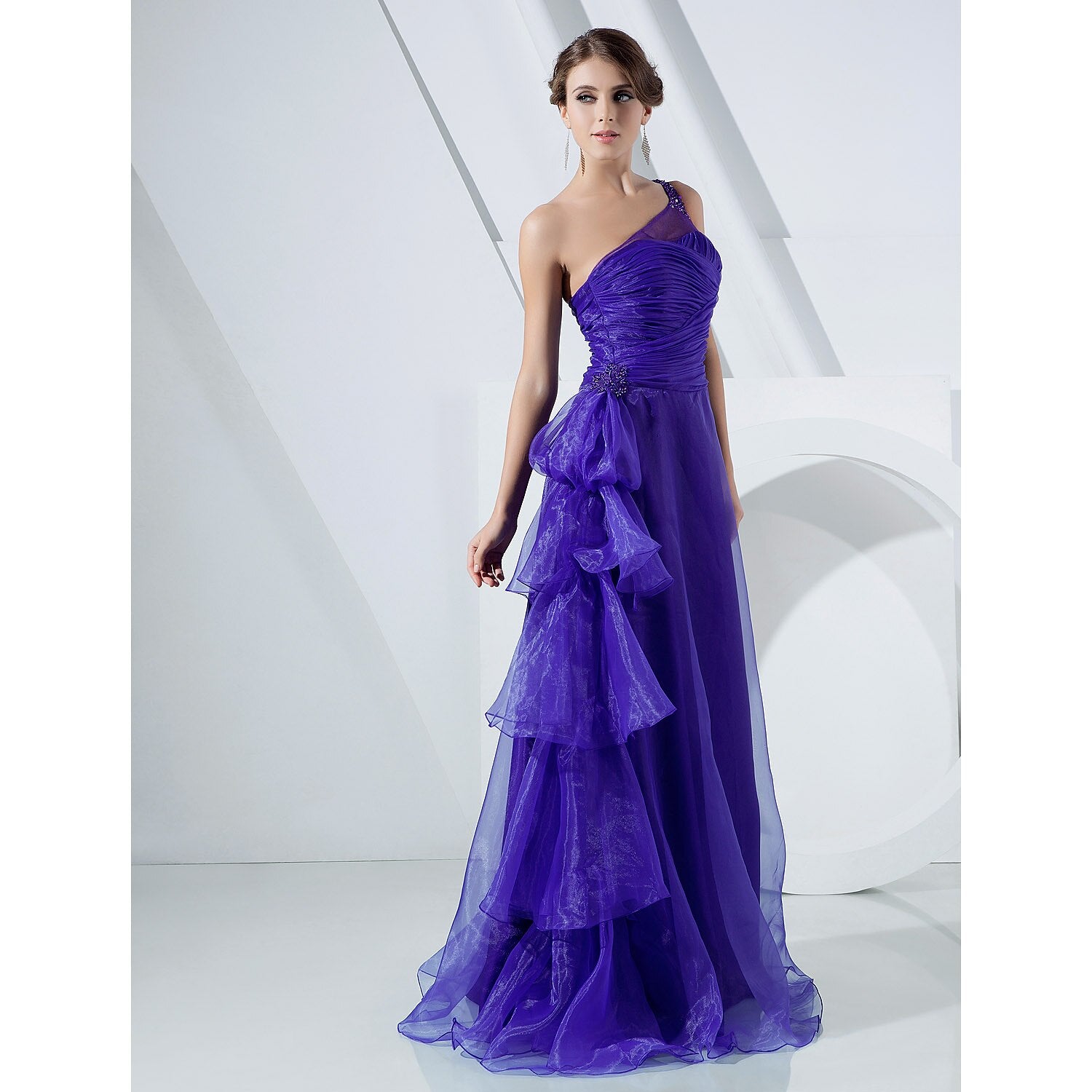 Elegant A-line one-shoulder organza gown with side draping and cascading ruffles.