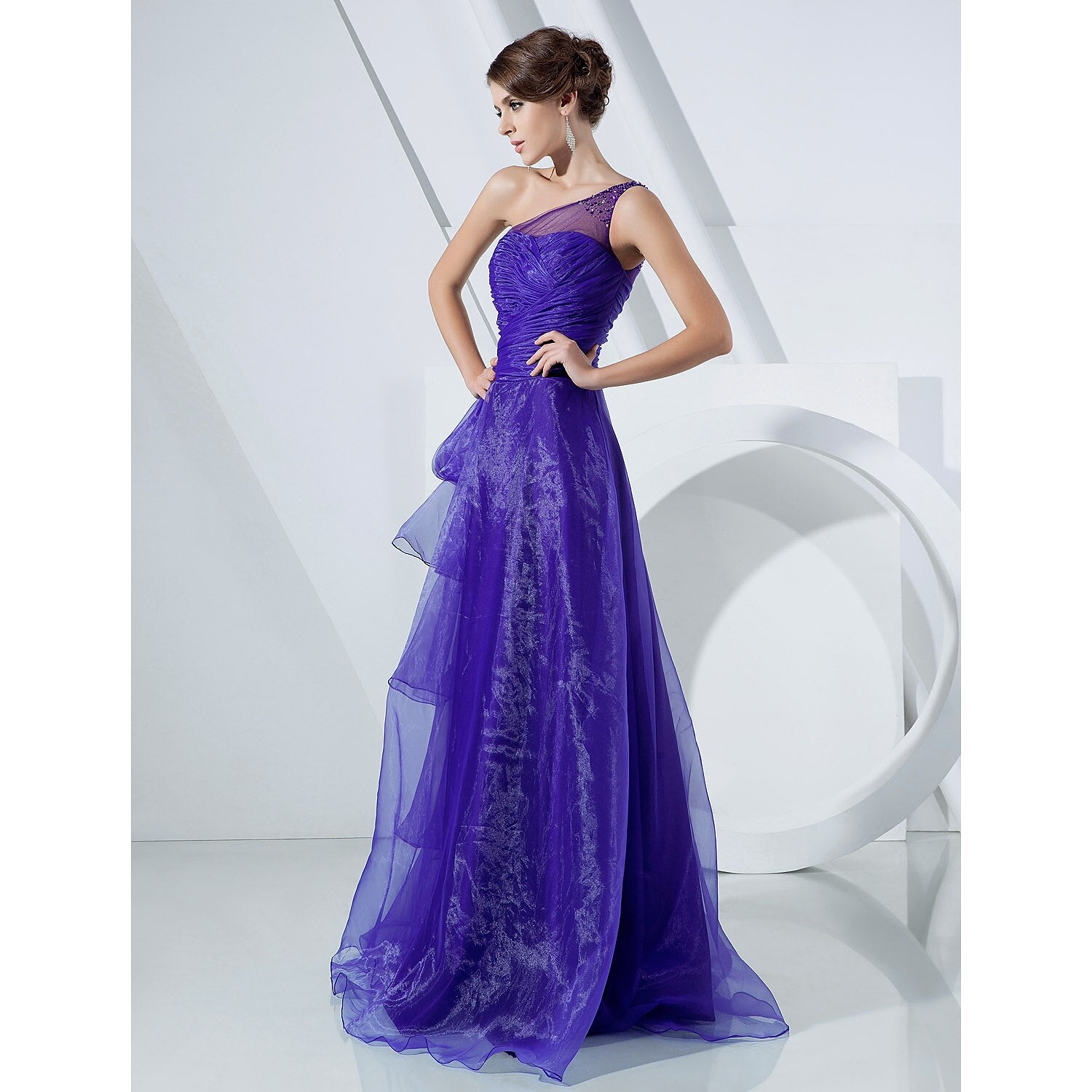Close-up of the one-shoulder neckline and organza fabric details.