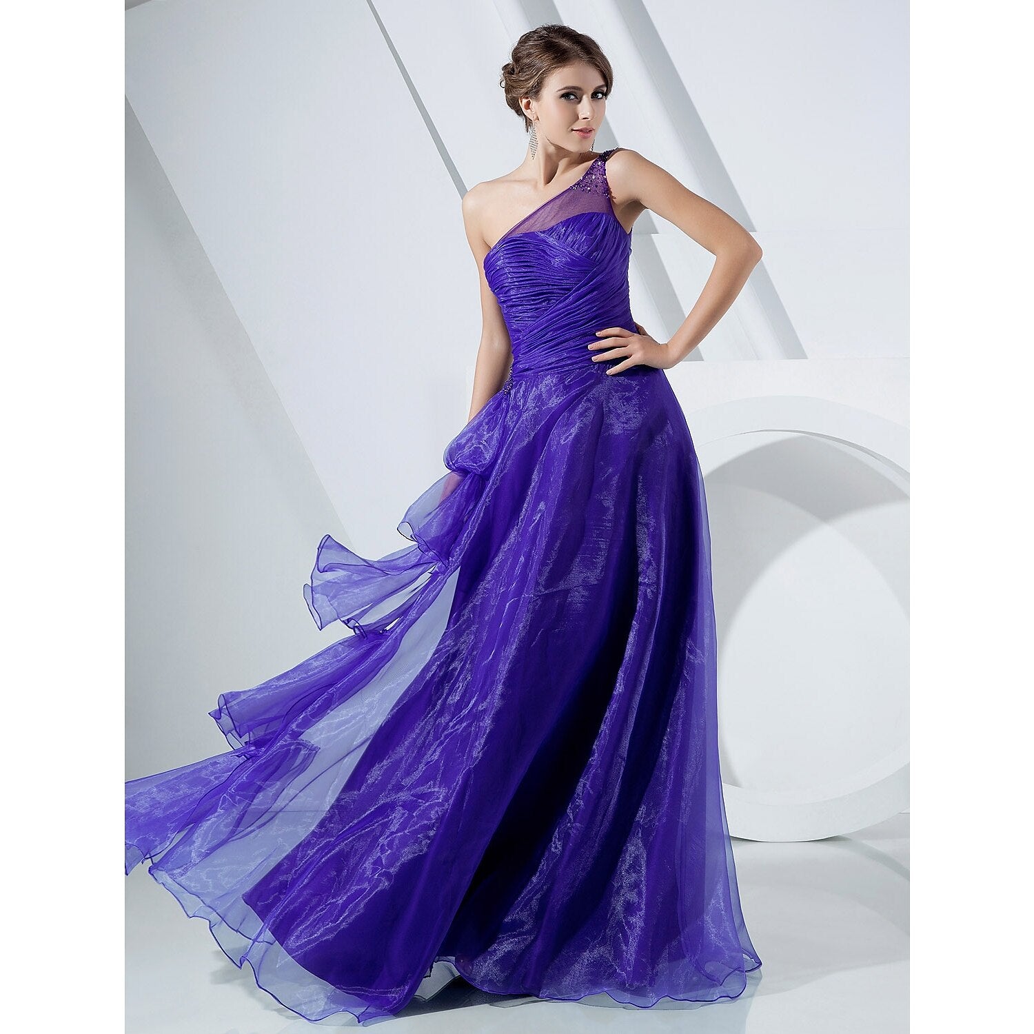 Side view of the floor-length gown showcasing cascading ruffles.