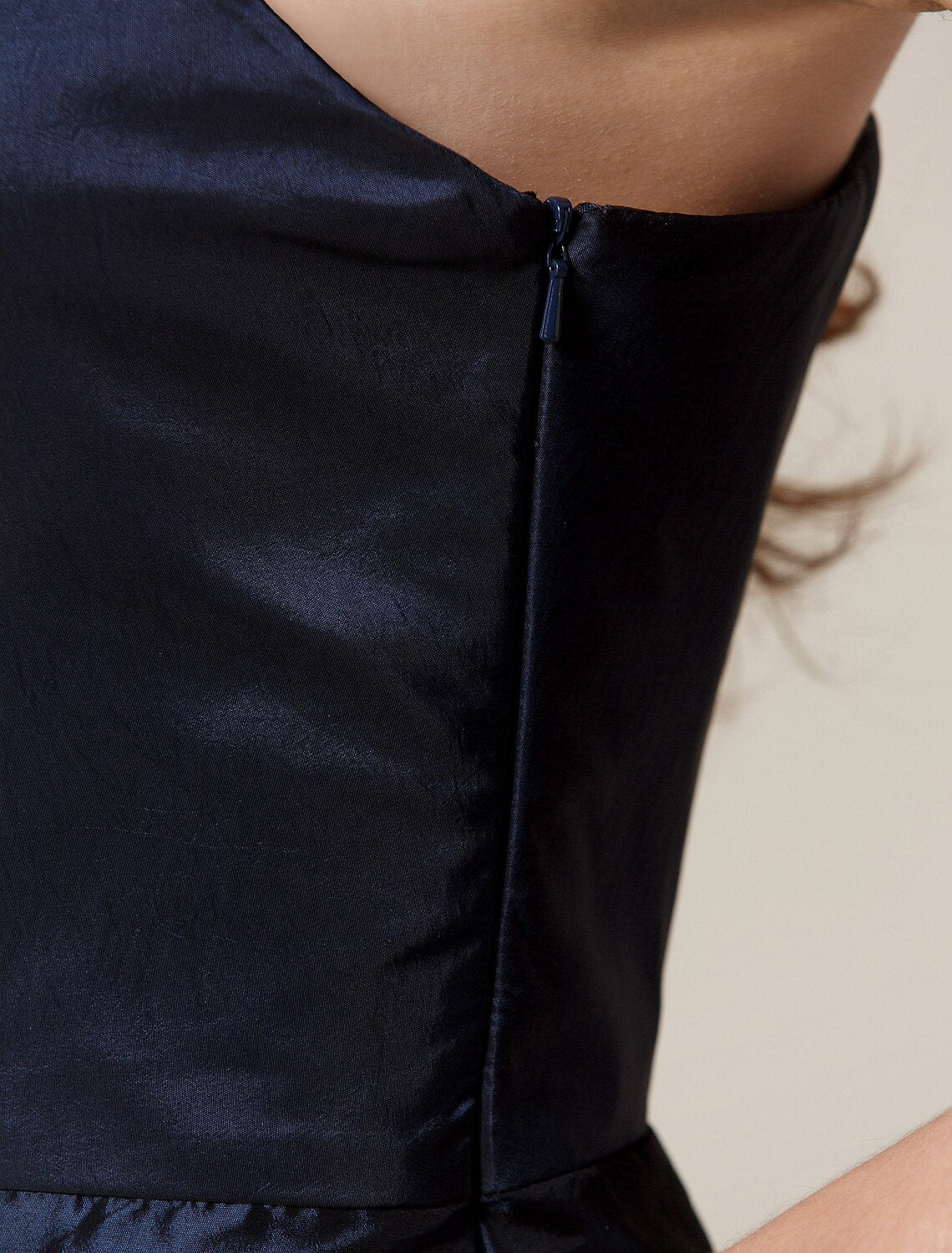 Side profile of the A-Line one-shoulder pleated taffeta dress.