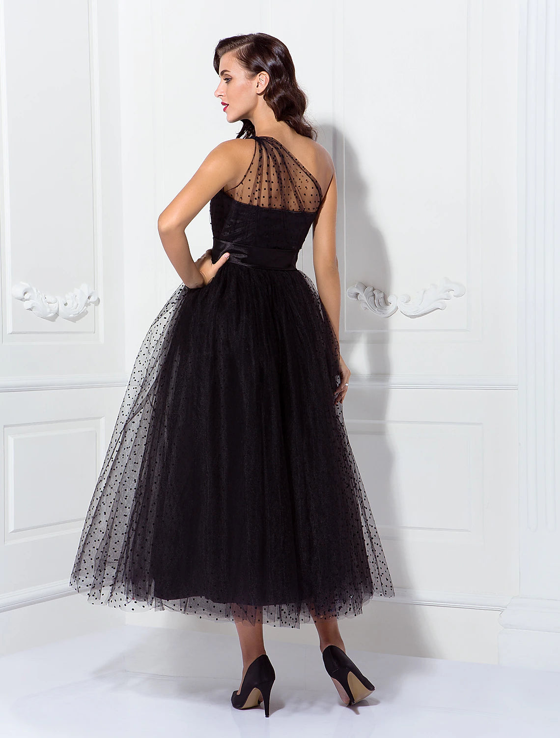 Detail of the tulle fabric and pleats on the cocktail gown.