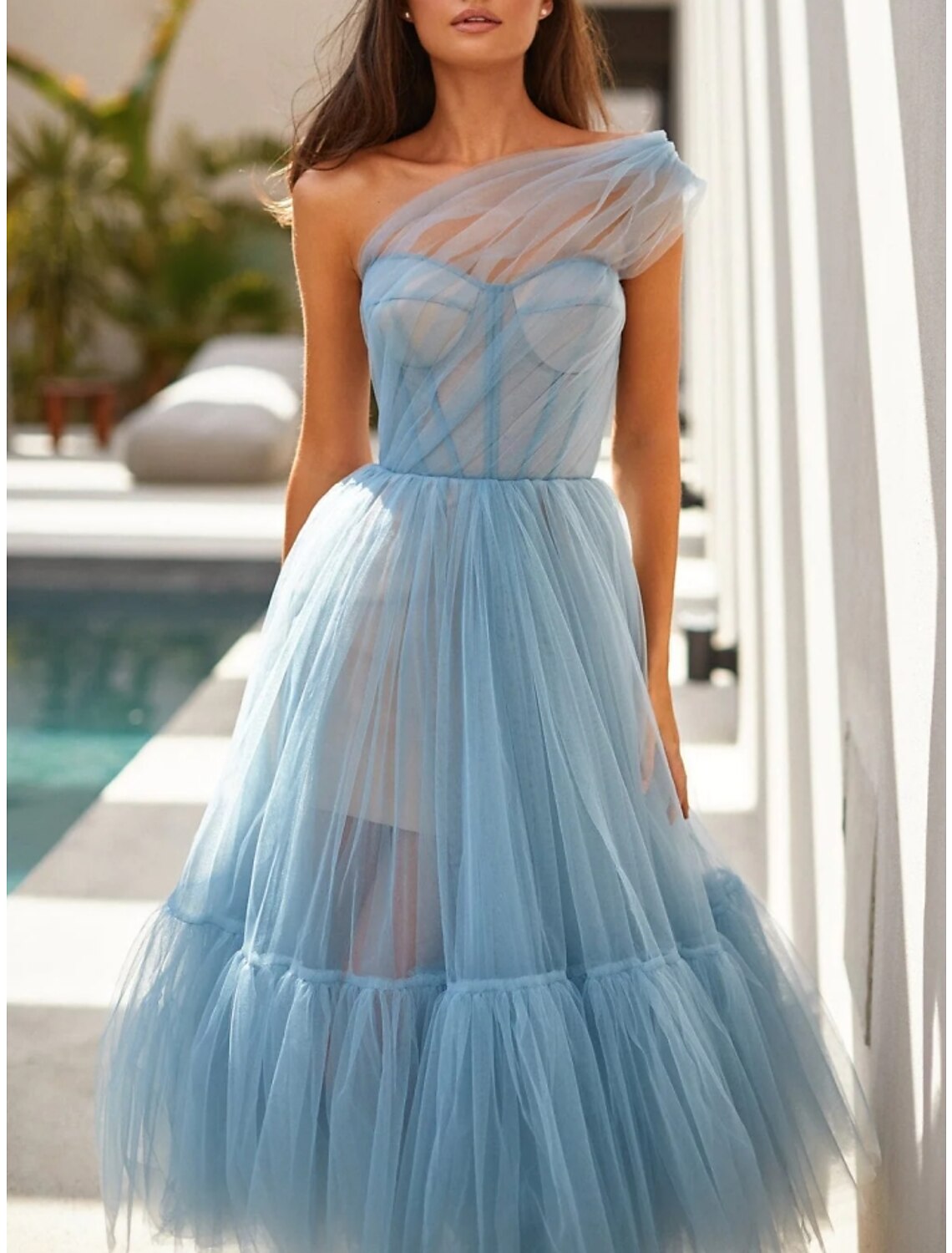 Close-up of the delicate pleated tulle fabric on the formal dress.