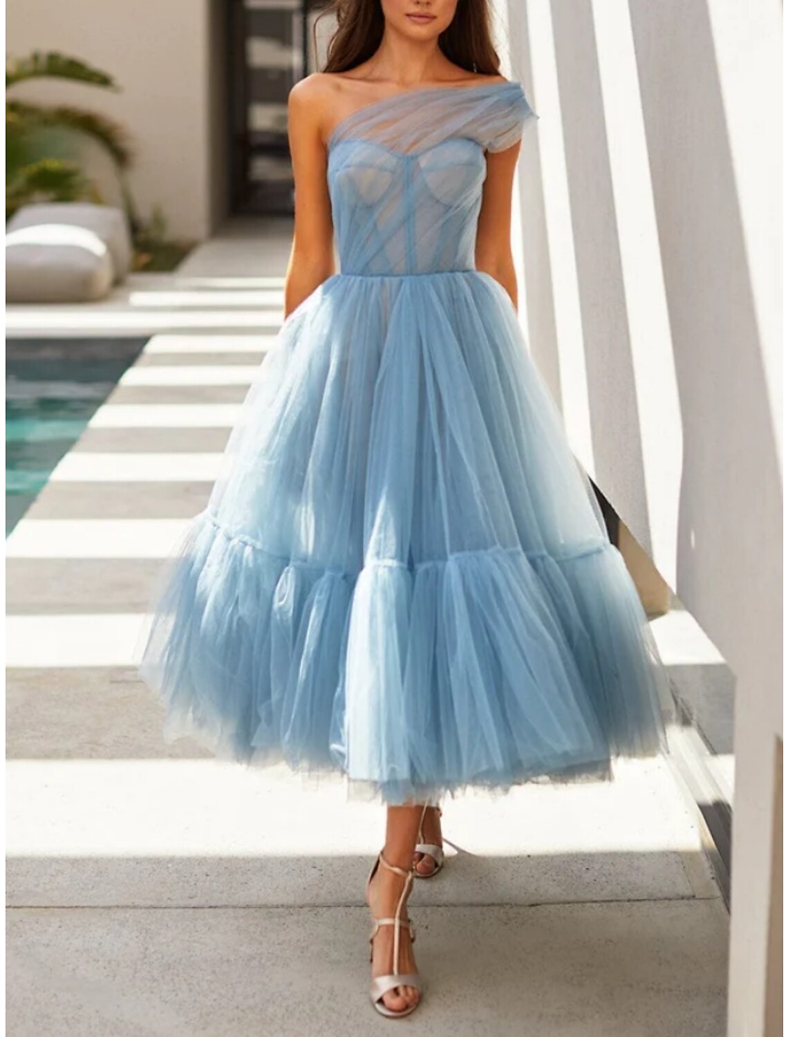 Model posing gracefully in the A-line one-shoulder formal dress.