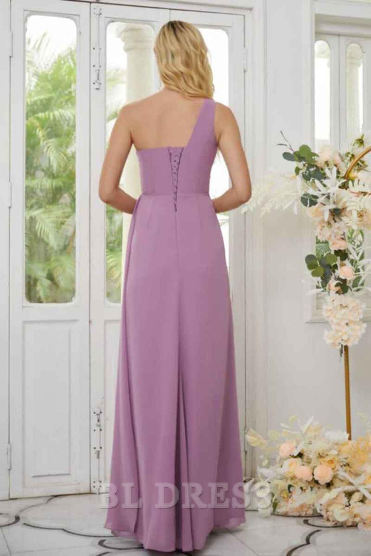 Back view of an A-line one-shoulder ruched chiffon dress.