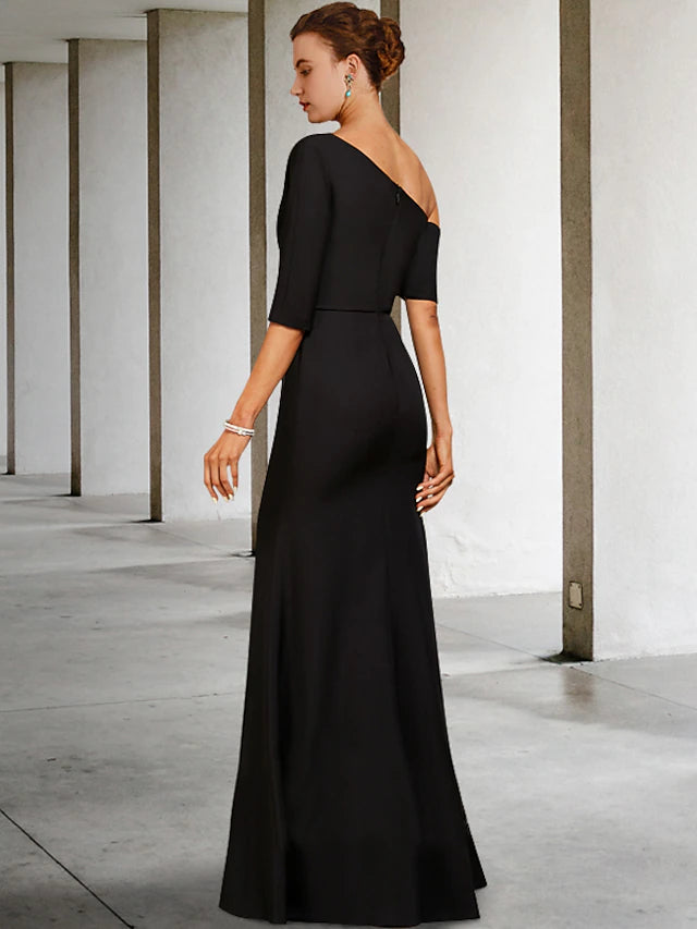 Detail of the one-shoulder neckline and delicate ruffles on the 3/4 length sleeve of the formal gown.