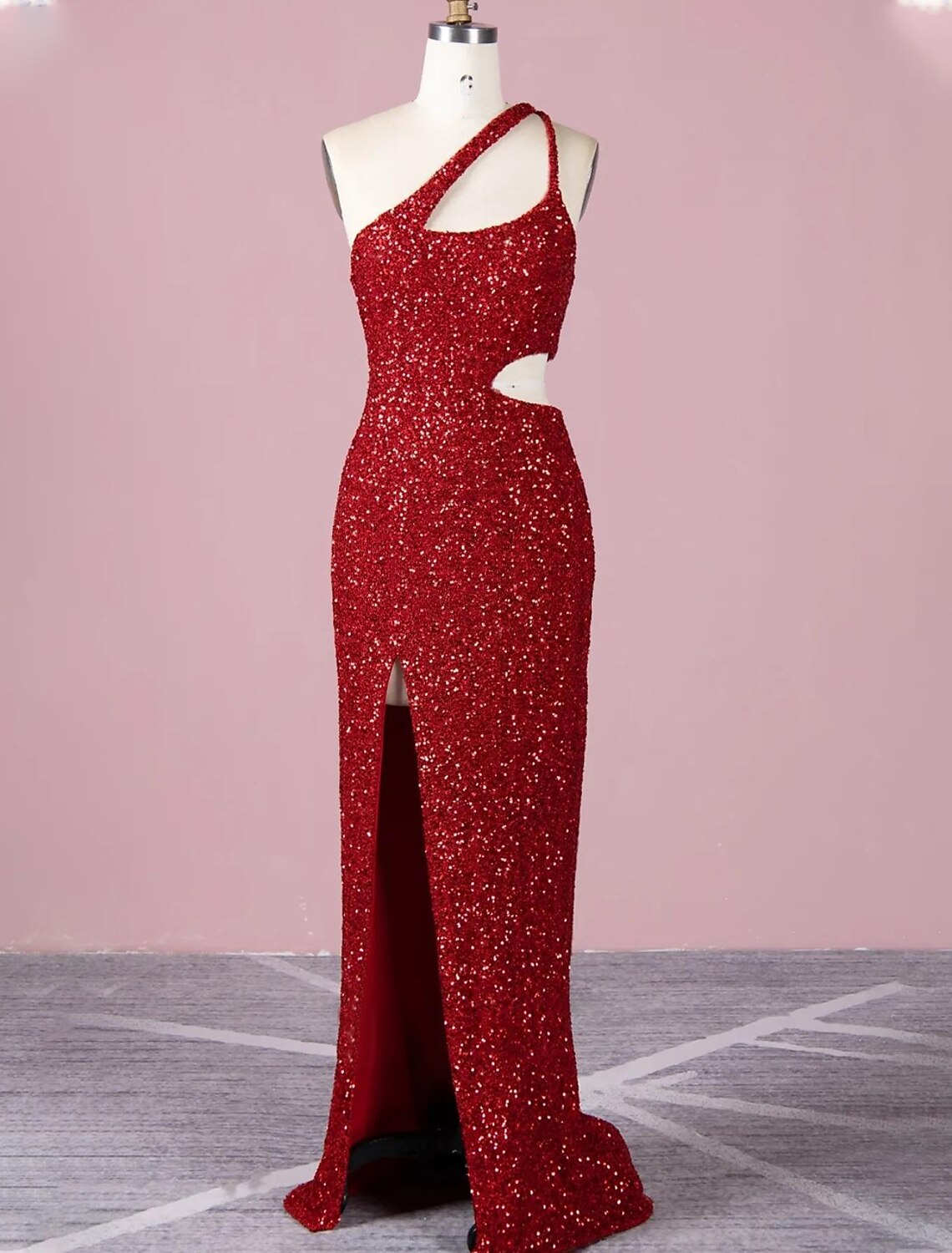 Elegant A-line one-shoulder sequined evening gown on a model.