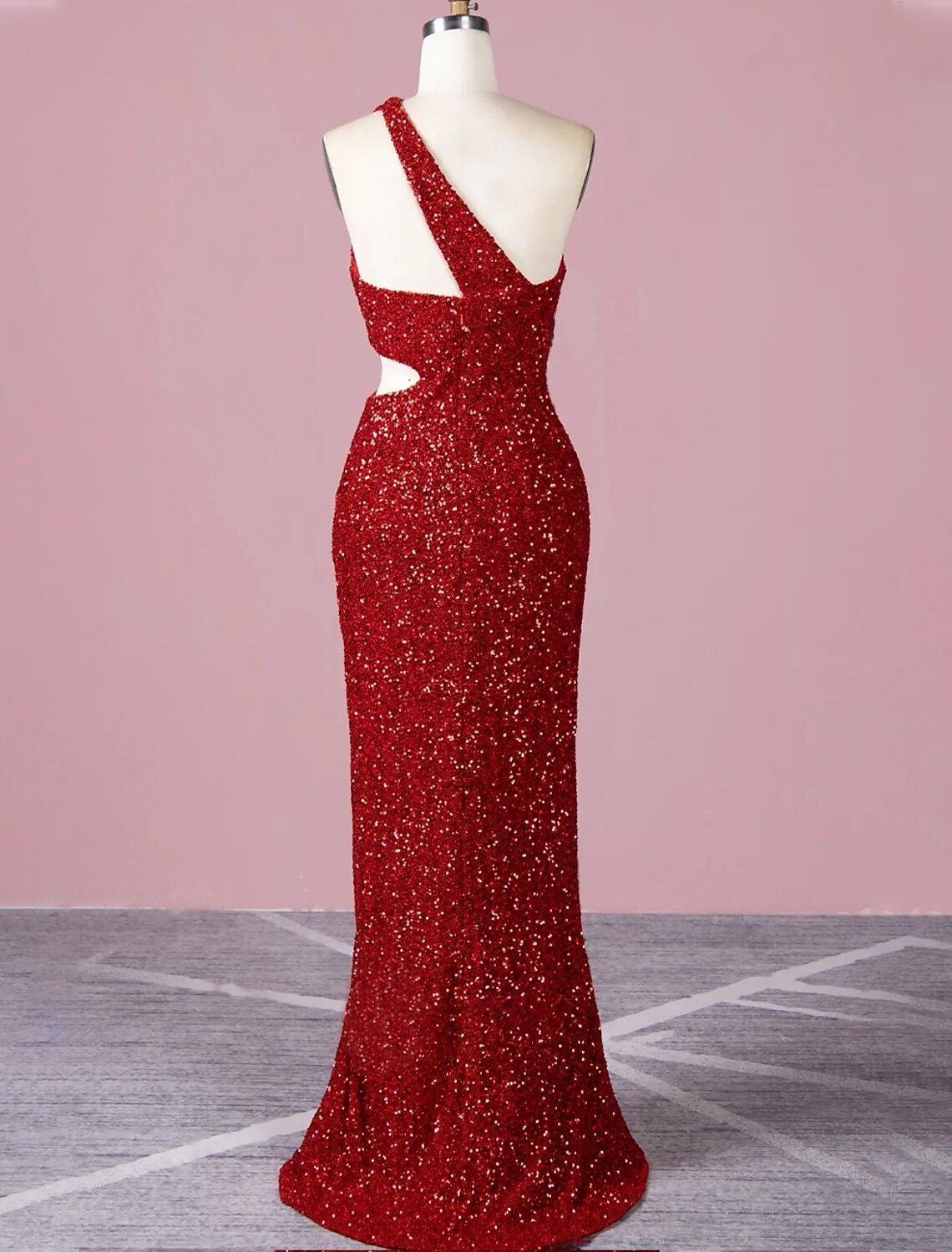 Side view of a model wearing the glittering floor-length formal dress.