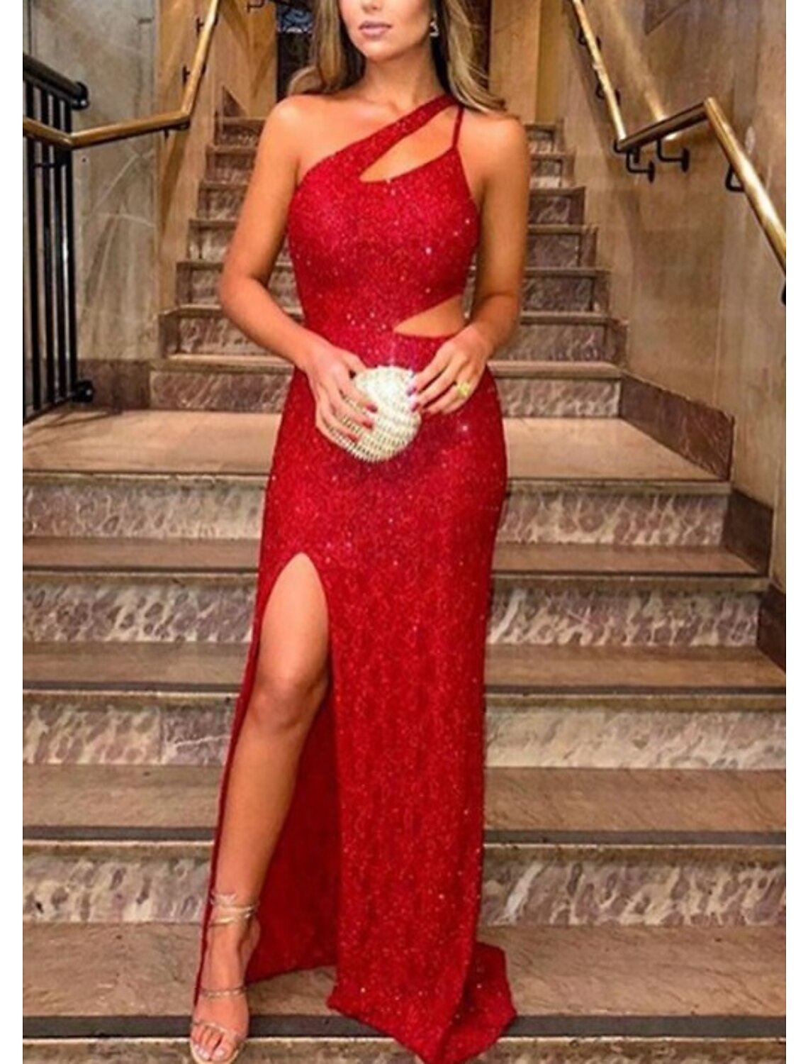 Close-up of the shimmering sequin detail on the one-shoulder dress.