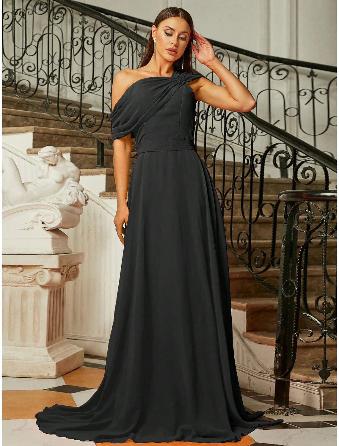 Side profile of the elegant one-shoulder dress with ruched detailing.