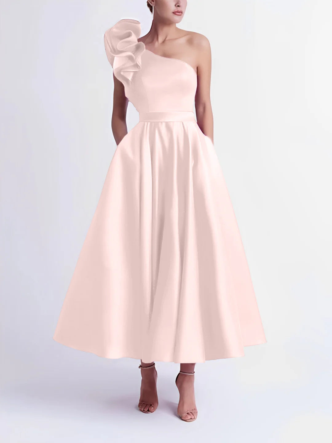 Model showcasing a pink A-line one-shoulder formal dress.