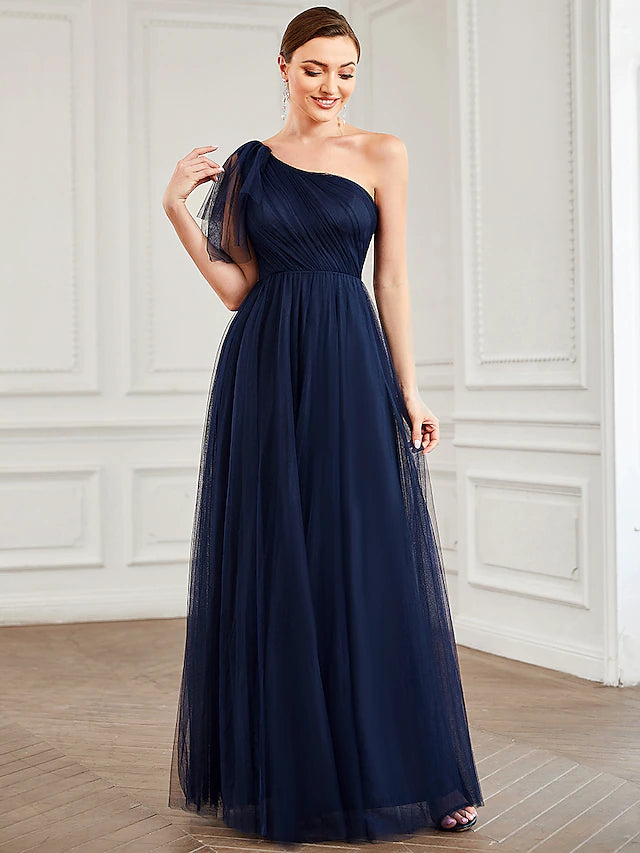 Close-up of the delicate shoulder flower on the tulle dress.
