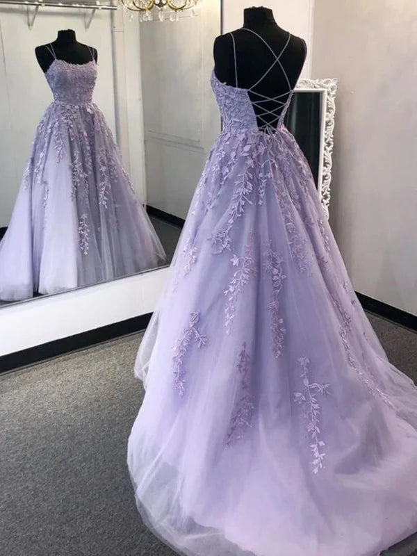Elegant long prom dress featuring an open back and delicate lace appliques.