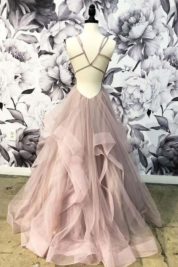 Back view of an elegant long prom dress, highlighting the open back design.