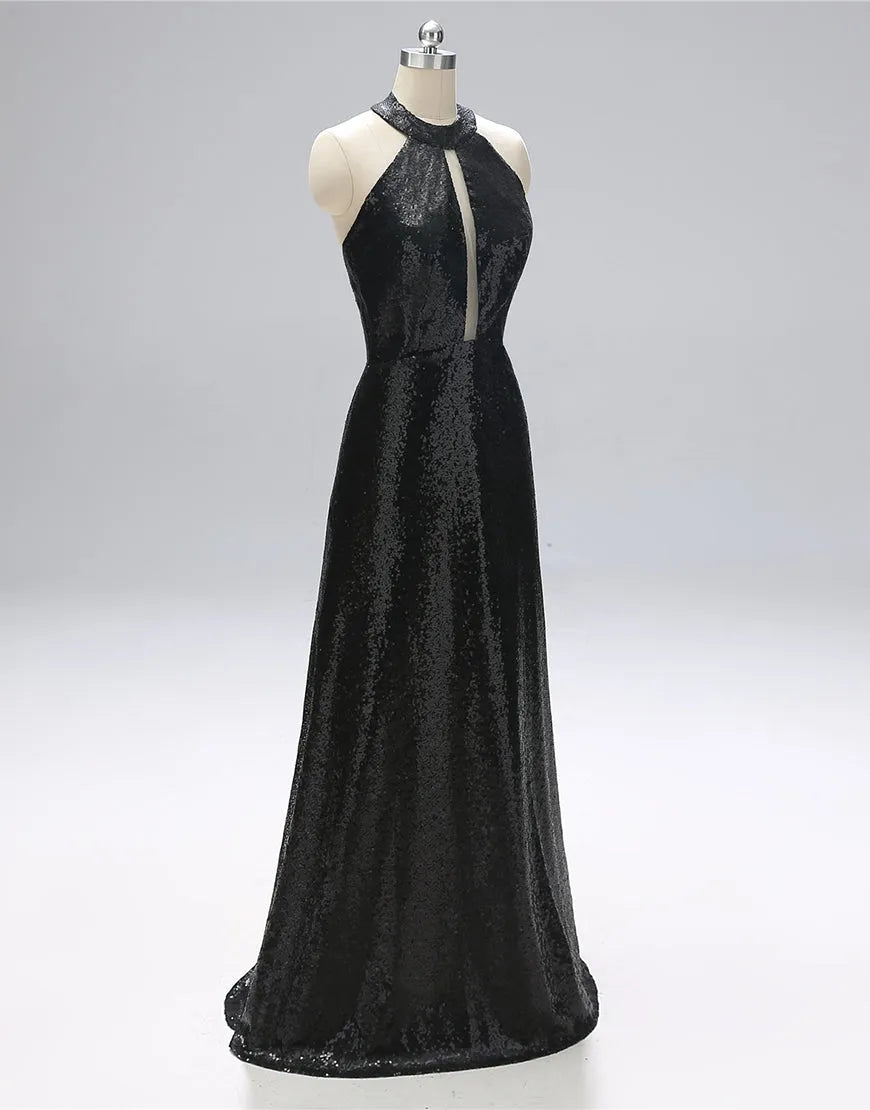 Woman wearing an elegant navy open-back floor-length prom gown.
