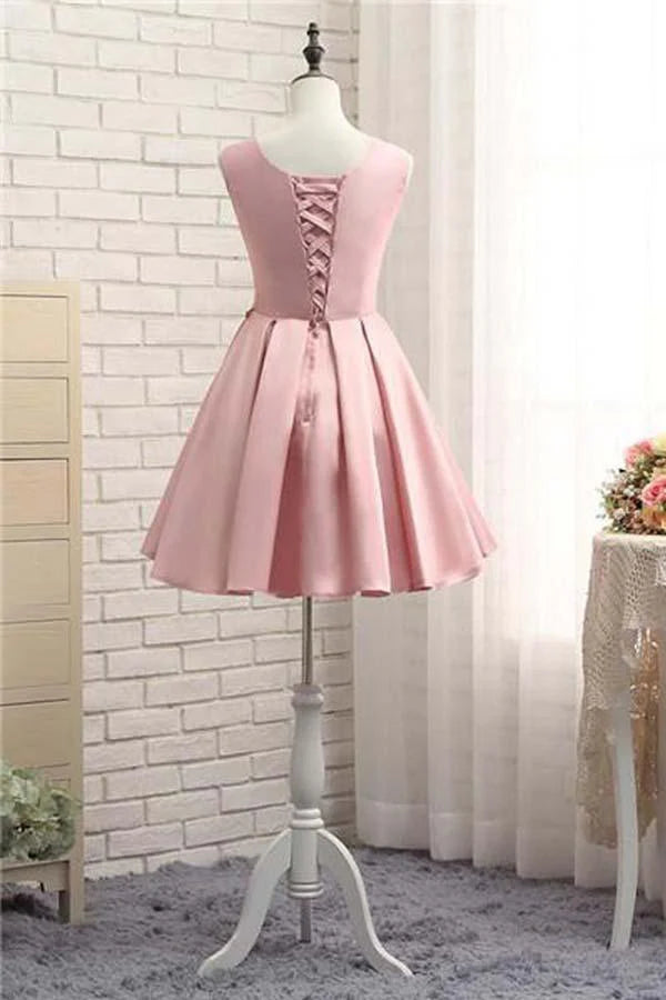 Back view of pink A-line short satin homecoming dress.