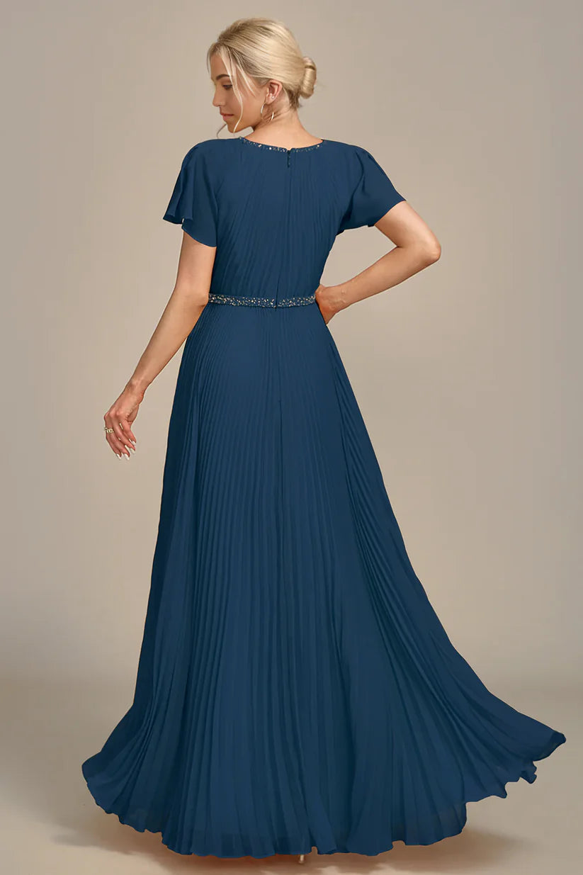 Side view of pleated A-line dress with short sleeves.