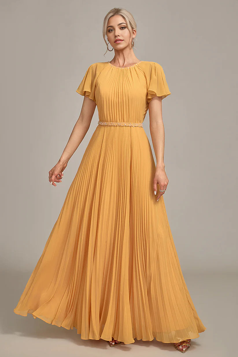 Close-up of pleated detail on A-line dress fabric.