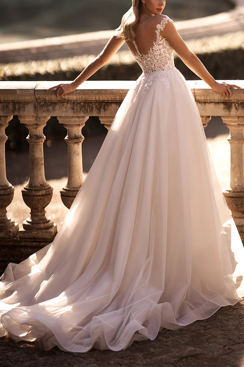Close-up of delicate lace appliques on the bodice of the wedding dress.
