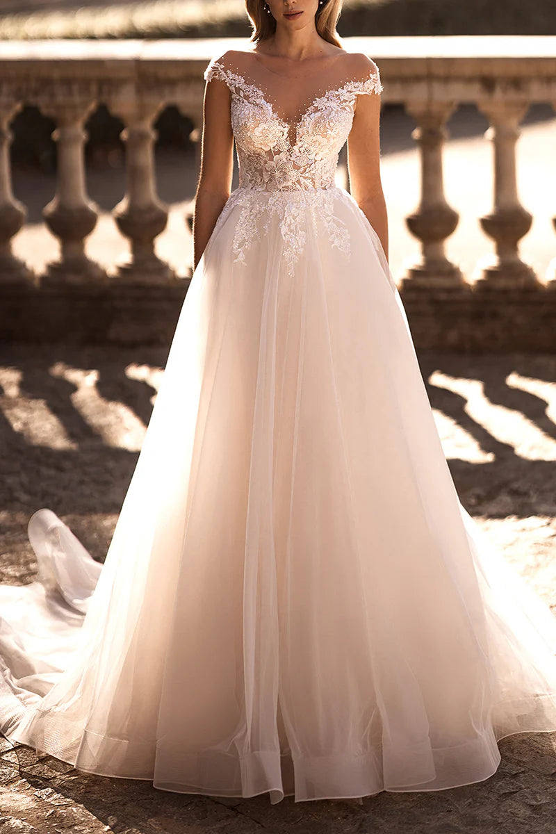 Back view of the A-line wedding gown with flowing skirt.