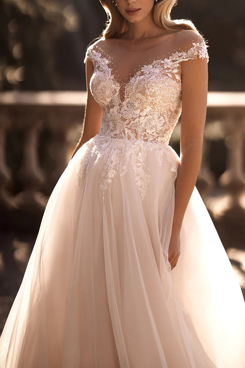 Side profile of the long A-line bridal dress with intricate detailing.