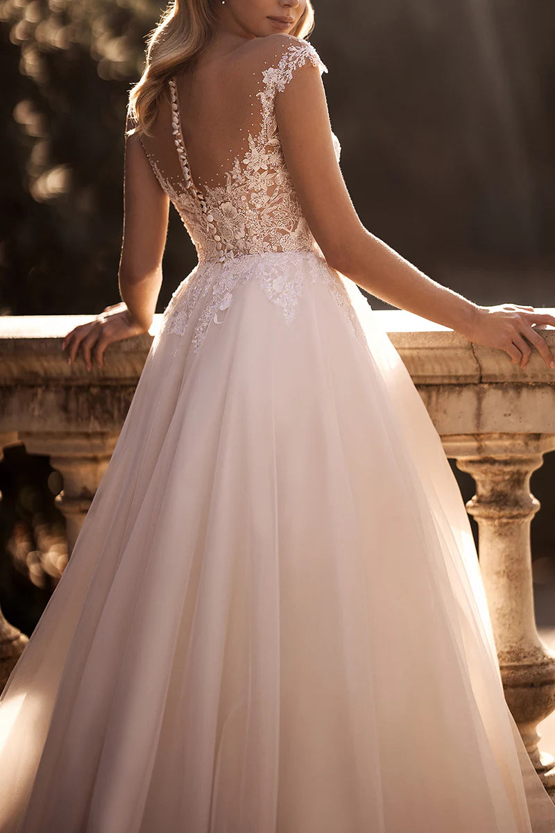 Detailed view of the skirt and train of the lace appliques wedding dress.