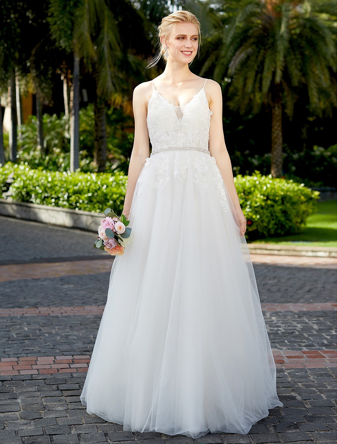 Elegant A-line wedding dress with plunging neck and tulle lace overlay.