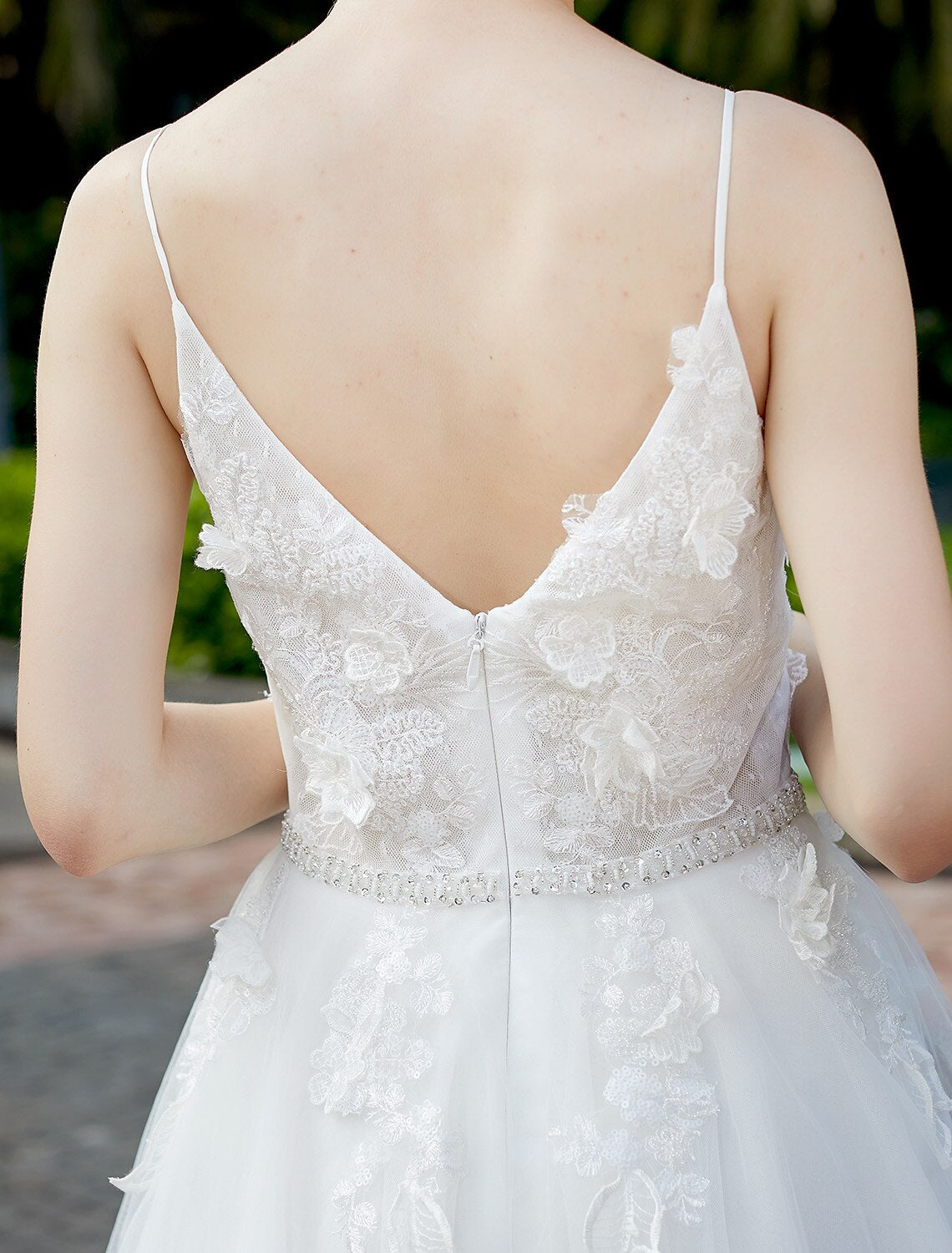 Elegant A-line wedding dress with plunging neck and tulle lace overlay.