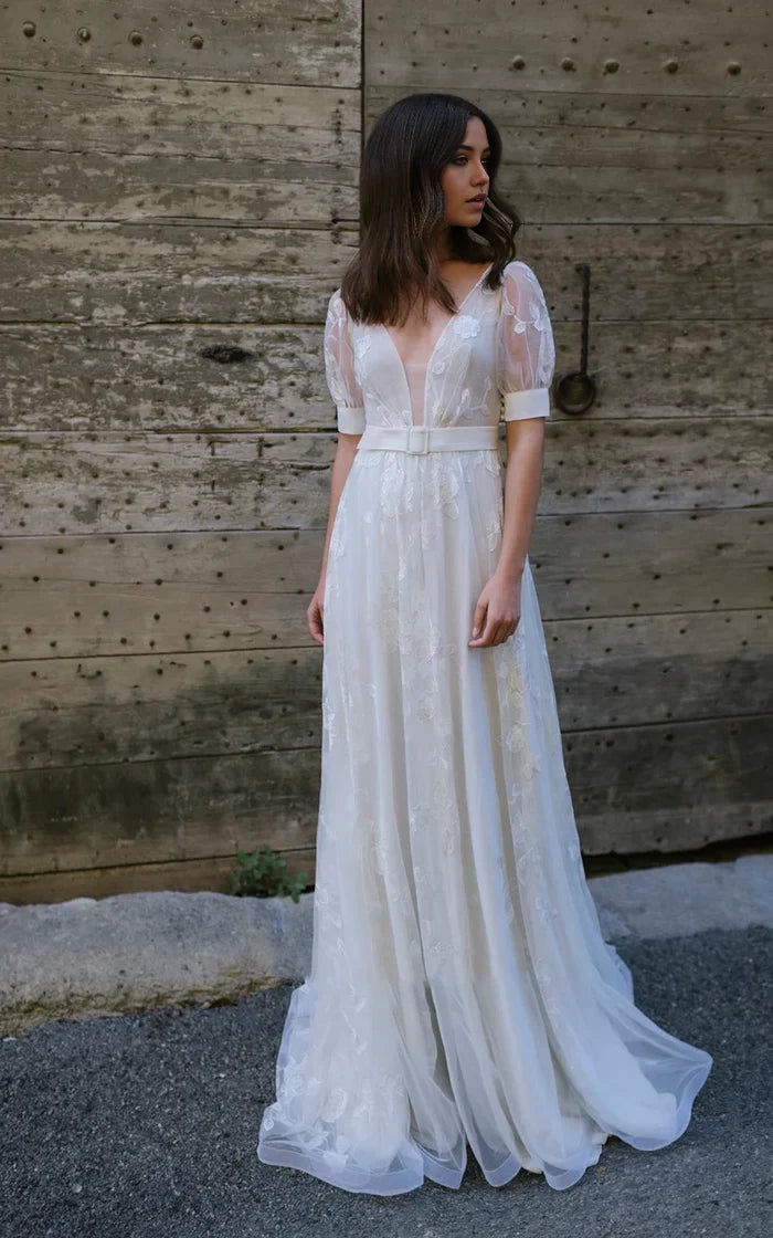 Front view of the elegant A-line wedding dress, featuring delicate tulle fabric.