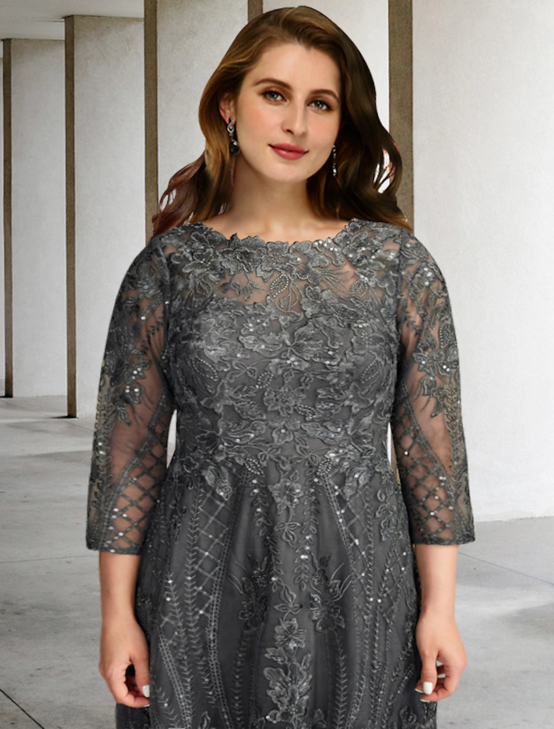 Close-up of the chiffon fabric and applique details on the elegant formal dress.